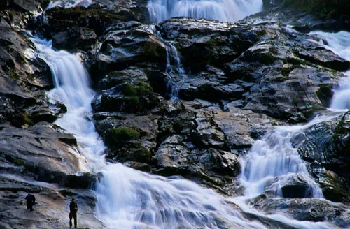 Fishermen at waterfall
