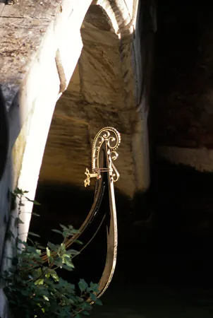 Gondola passing under bridge