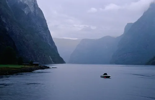 Small boat in big Fjord
