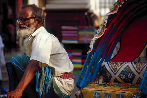 Rickshaw driver waiting for his next customer